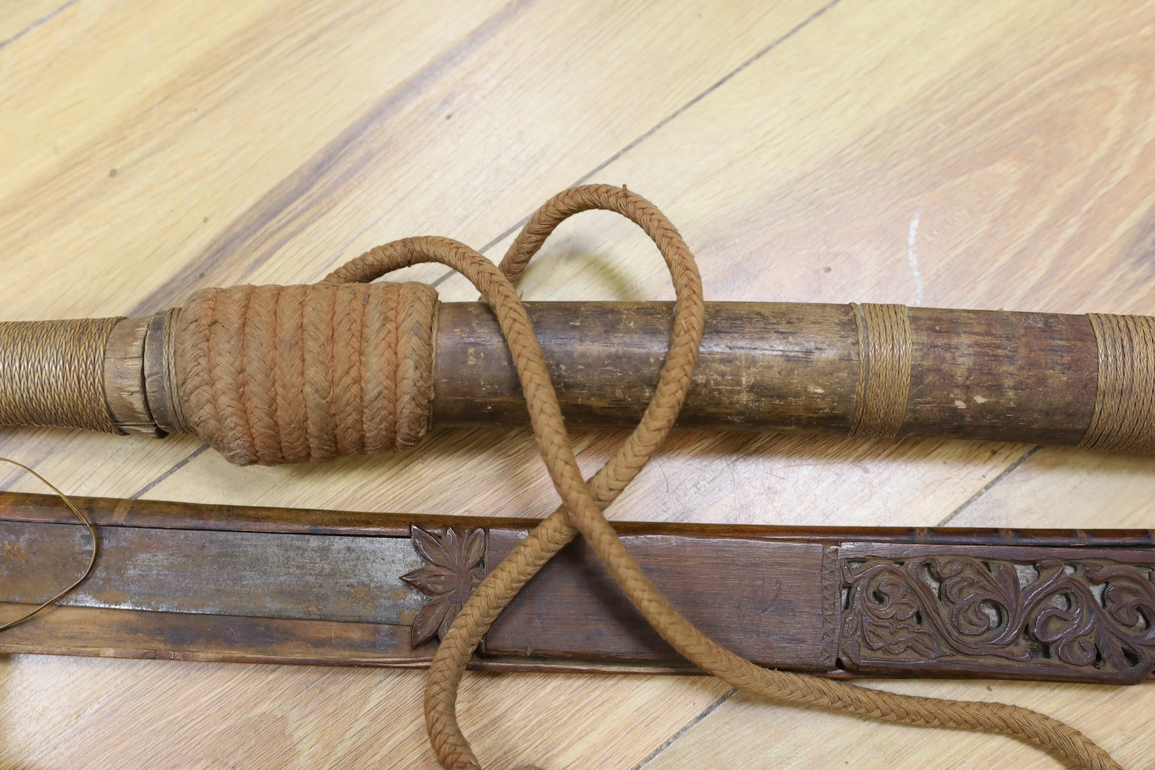 Two Burmese dha swords.